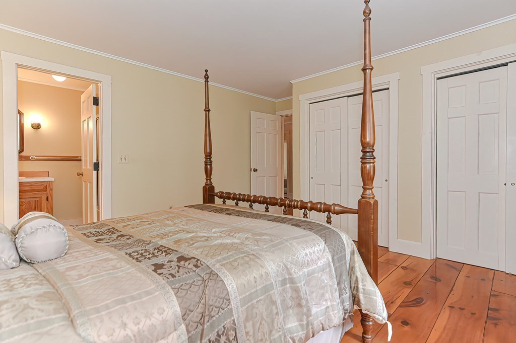 142 Middleboro Road Freetown, MA 02717 - Photo 20 of 42 a bedroom with a bed and a mirror