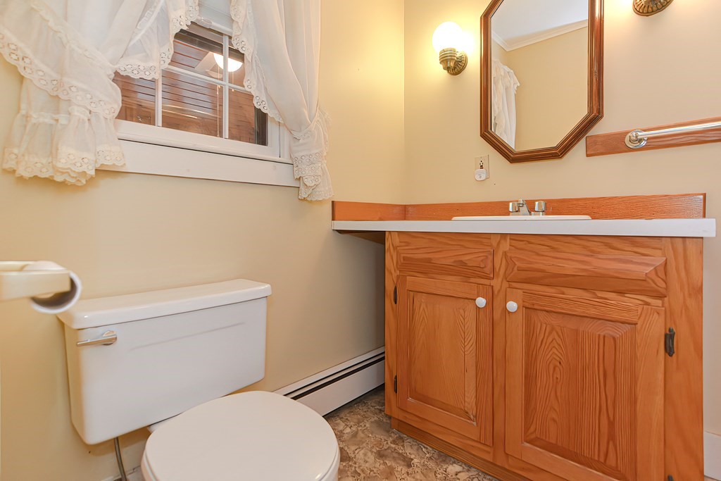 142 Middleboro Road Freetown, MA 02717 - Photo 22 of 42 a bathroom with a toilet a sink and mirror