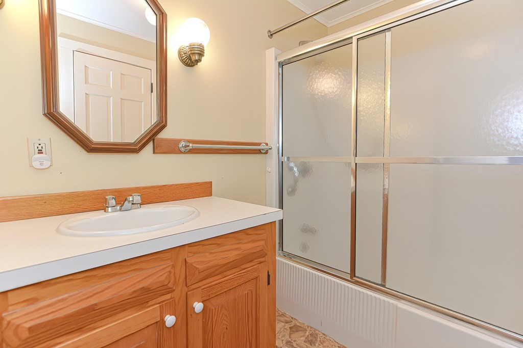142 Middleboro Road Freetown, MA 02717 - Photo 23 of 42 a bathroom with a sink and a mirror