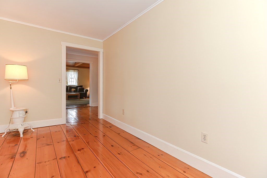 142 Middleboro Road Freetown, MA 02717 - Photo 24 of 42 a view of a room with wooden floor and a flat screen tv