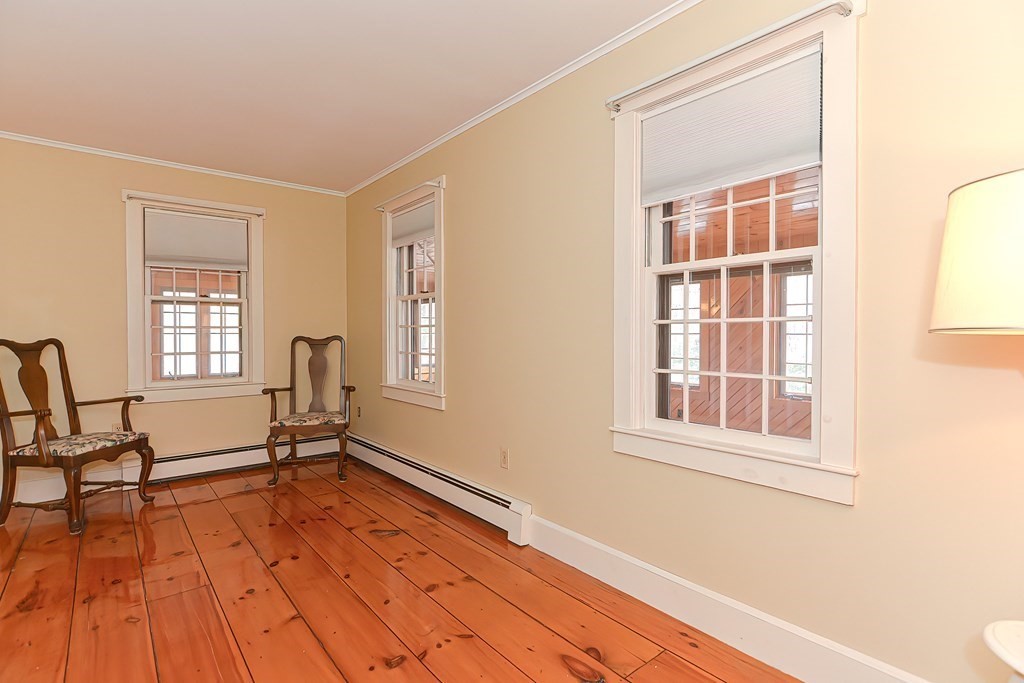 142 Middleboro Road Freetown, MA 02717 - Photo 25 of 42 a view of a livingroom with wooden floor and a window