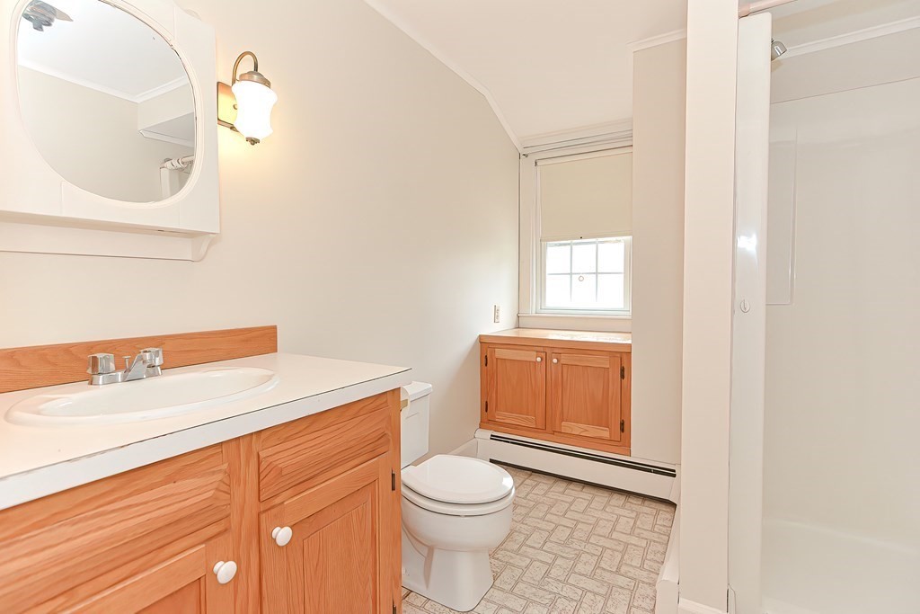 142 Middleboro Road Freetown, MA 02717 - Photo 36 of 42 a bathroom with a sink a toilet and vanity