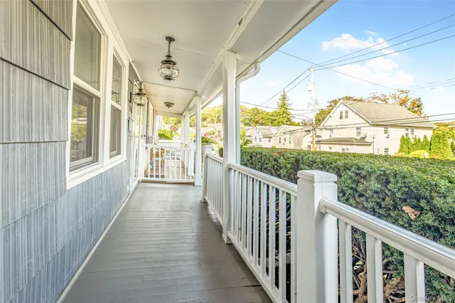 a view of a porch with wooden floor and outer view