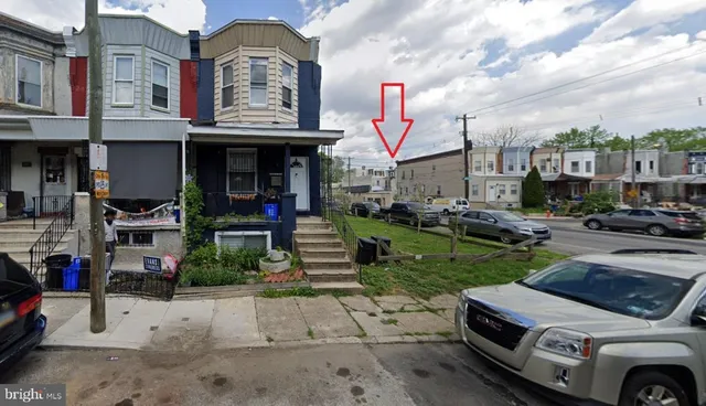 a house view with a sitting space and garden space