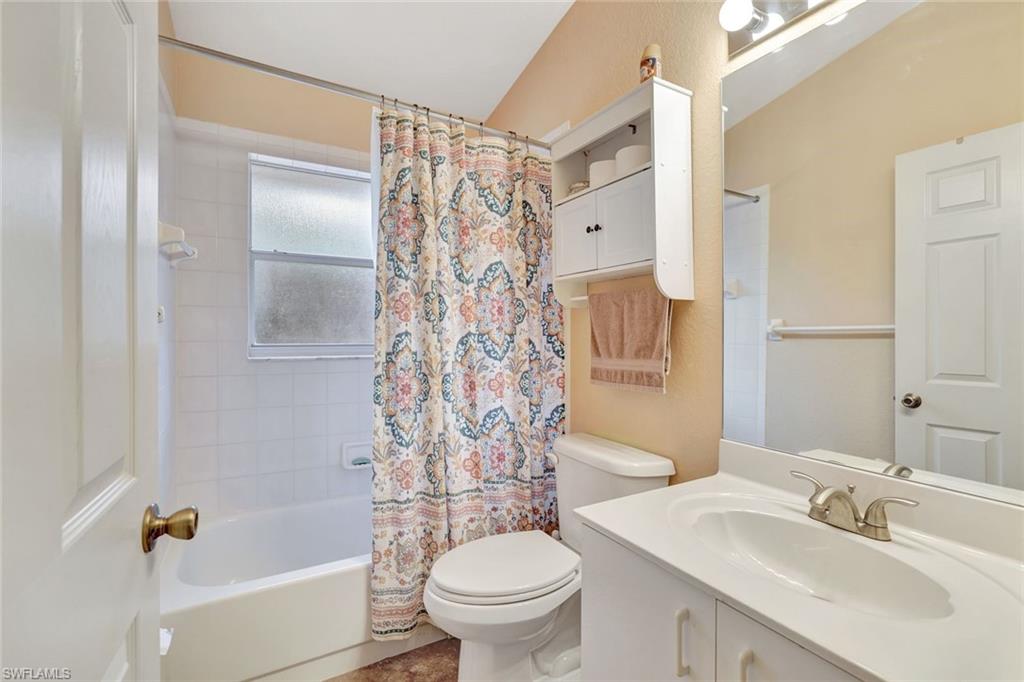 660 20th Street Southeast Naples, FL 34117 - Photo 11 of 17 Bathroom featuring shower / tub combo and vanity