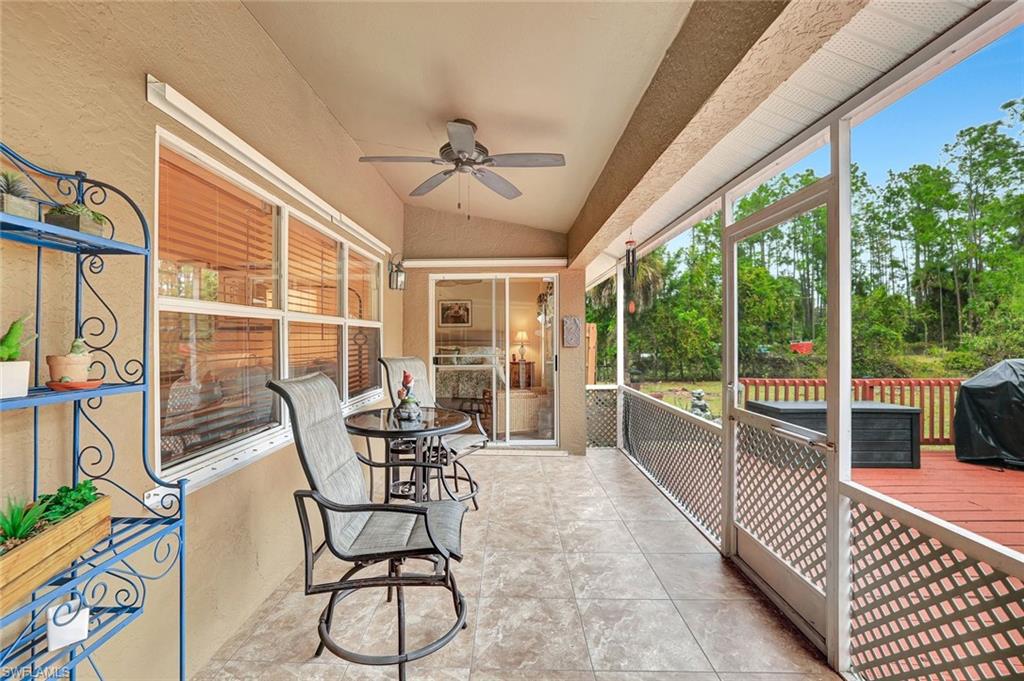 660 20th Street Southeast Naples, FL 34117 - Photo 13 of 17 Sunroom featuring vaulted ceiling and a ceiling fan