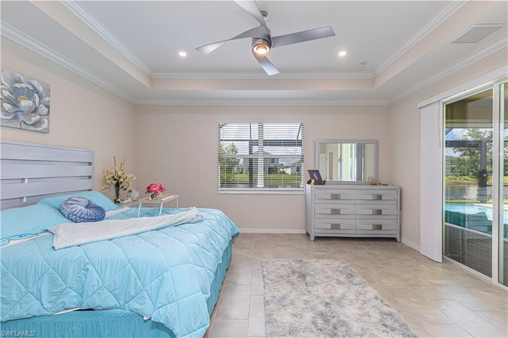 2079 Vermont Lane Naples, FL 34120 - Photo 13 of 13 a bedroom with a bed and wooden floor