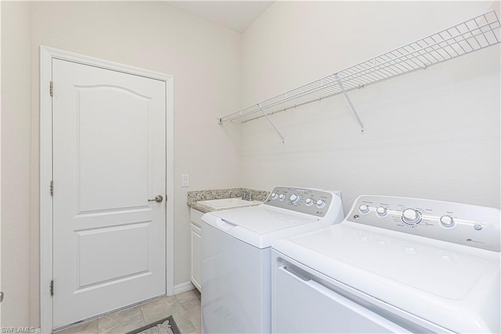 2079 Vermont Lane Naples, FL 34120 - Photo 10 of 13 a utility room with dryer and washer