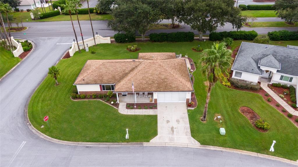 9074 Southeast 135th Loop Summerfield, FL 34491 - Photo 16 of 16 an aerial view of a house with garden space and street view