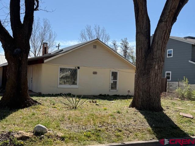 a house view with a backyard space