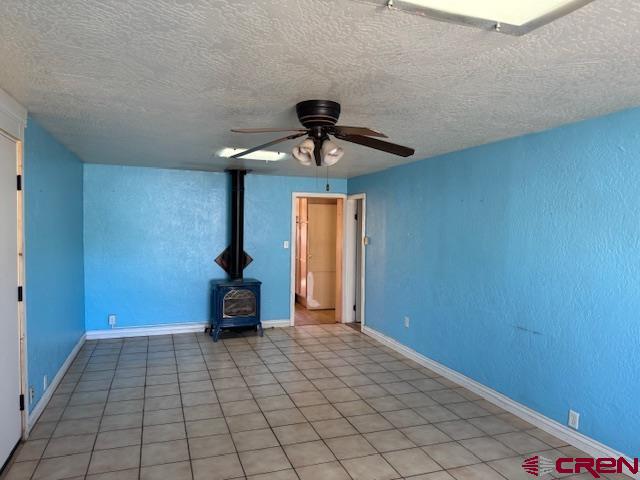 502 South Ash Street Cortez, CO 81321 - Photo 12 of 14 a bedroom with a bed and ceiling fan