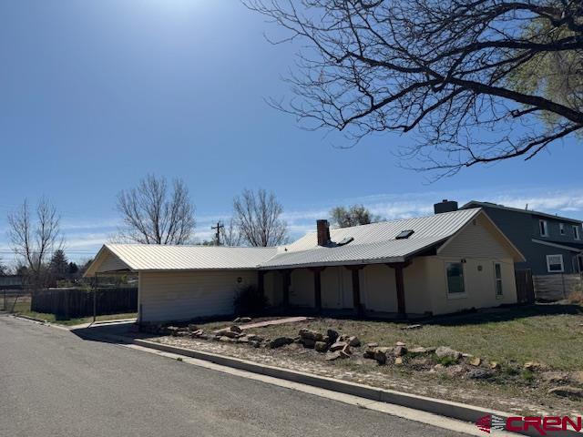 502 South Ash Street Cortez, CO 81321 - Photo 14 of 14 a view of a house with snow on the road