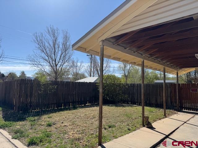 502 South Ash Street Cortez, CO 81321 - Photo 3 of 14 a backyard of a house with a basket ball court