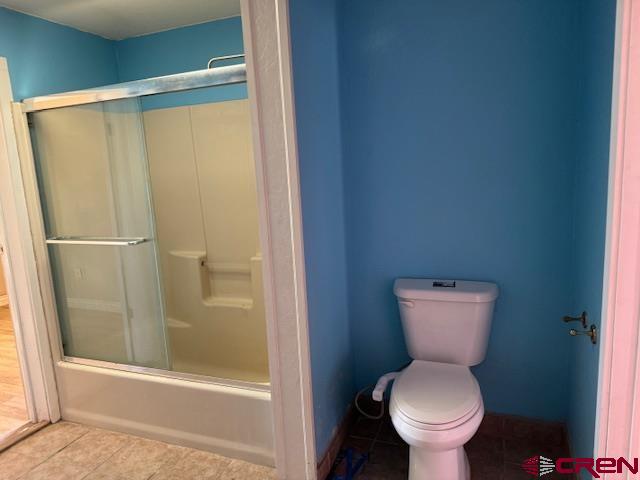 502 South Ash Street Cortez, CO 81321 - Photo 7 of 14 a white toilet sitting next to a shower
