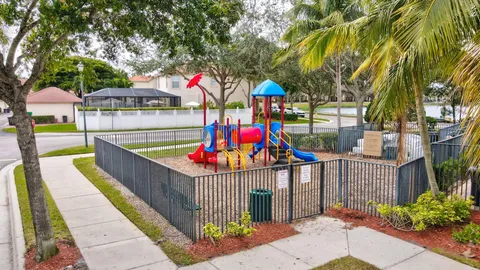 a view of small park with large trees