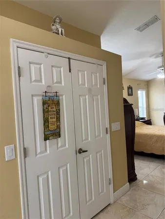 a kitchen with a sink cabinets and wooden floor