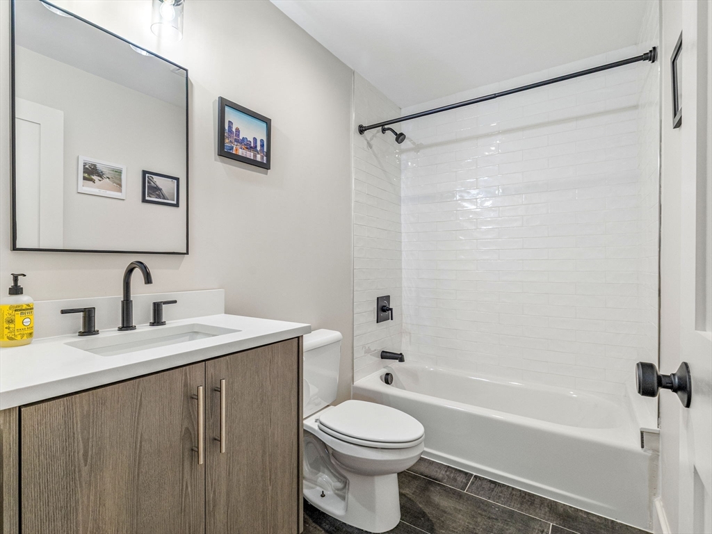 88 Wales Street, Unit 3 Boston, MA 02124 - Photo 15 of 18 a bathroom with a sink a toilet and a bathtub