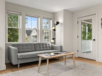 a living room with furniture and a window