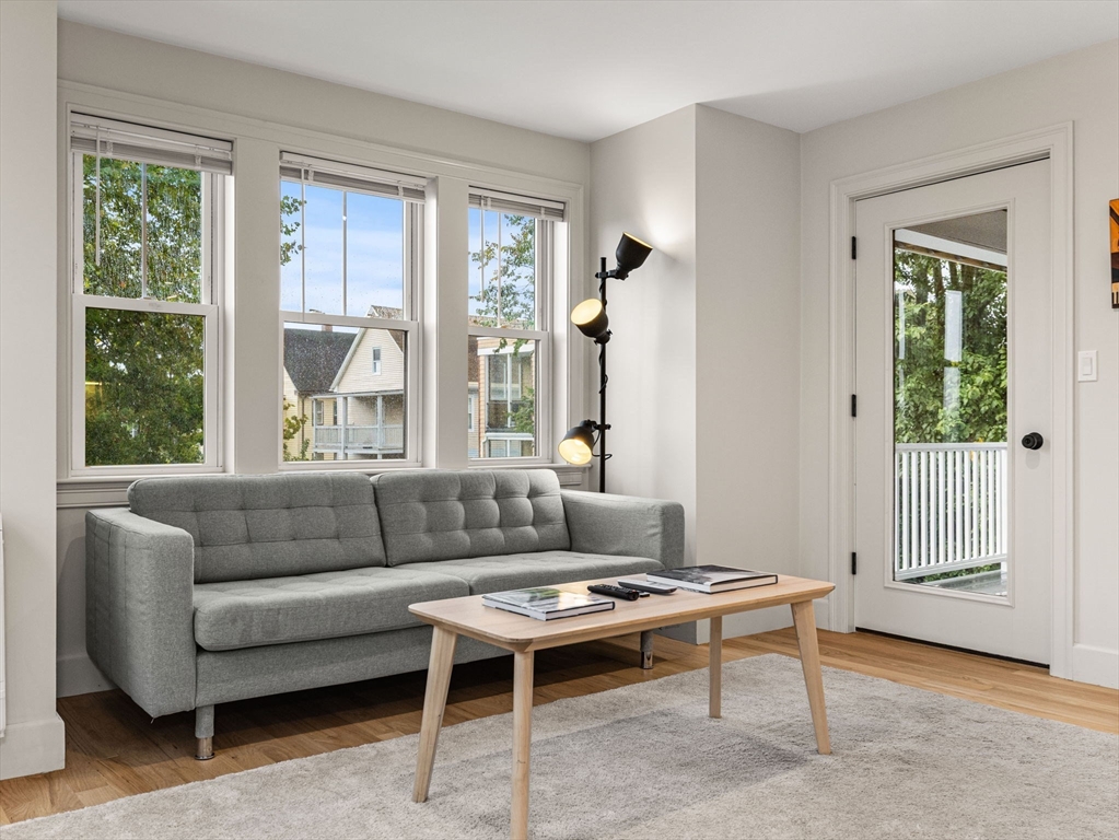 88 Wales Street, Unit 3 Boston, MA 02124 - Photo 5 of 18 a living room with furniture and a window