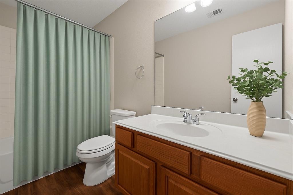 9936 Long Rifle Drive Fort Worth, TX 76108 - Photo 11 of 17 a bathroom with a sink toilet and shower