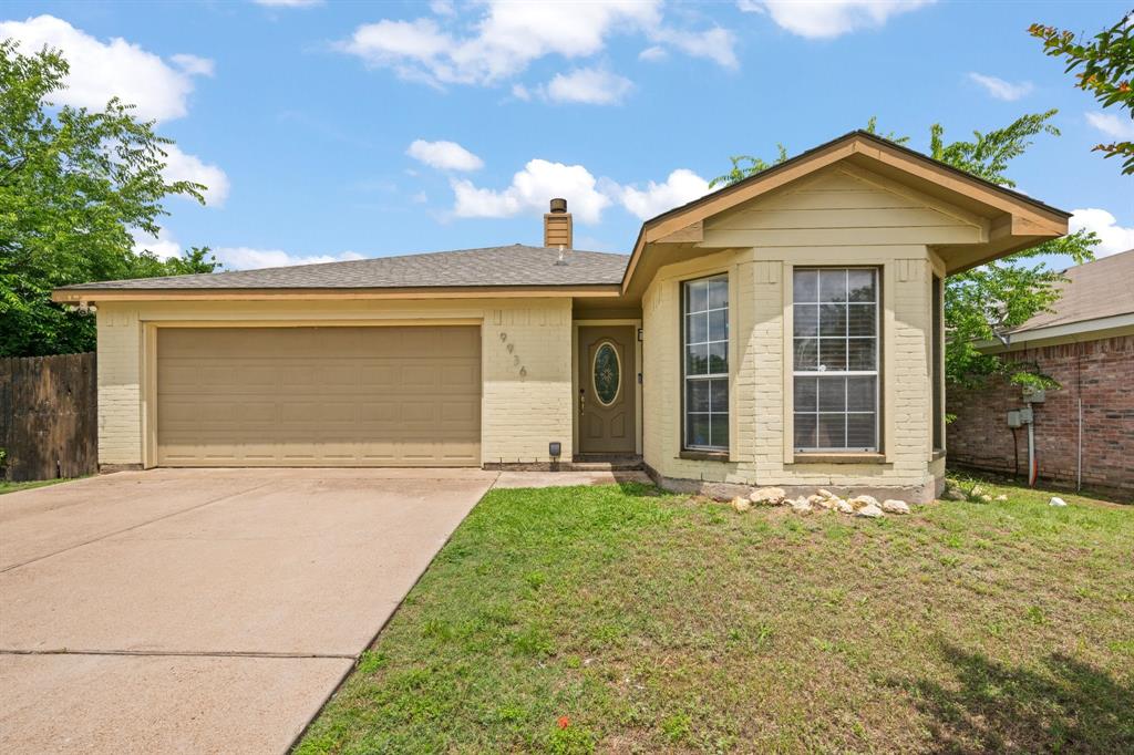 9936 Long Rifle Drive Fort Worth, TX 76108 - Photo 17 of 17 a front view of a house with a yard and garage