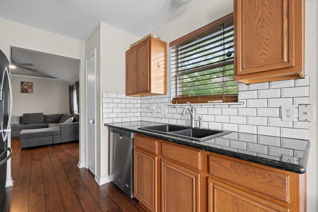 9936 Long Rifle Drive Fort Worth, TX 76108 - Photo 6 of 17 a kitchen with sink and cabinets