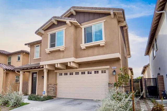 a front view of a house with garage