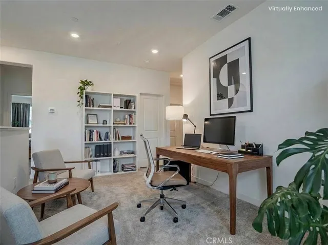 a view of a workspace with furniture