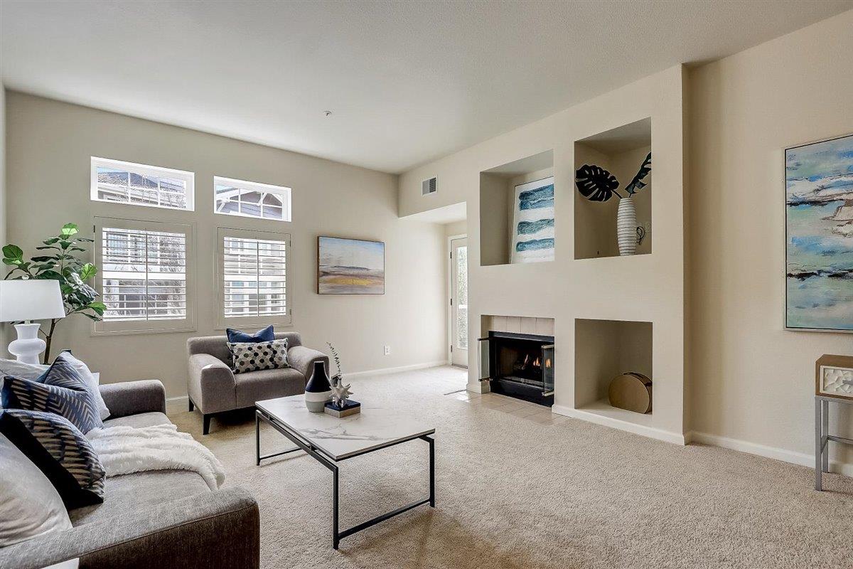 633 Swallowtail Court Brisbane, CA 94005 - Photo 1 of 42 a living room with furniture window and a fireplace