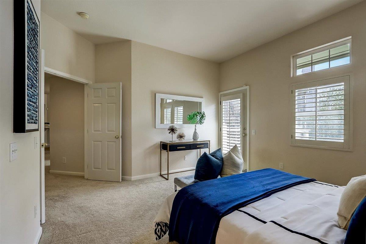 633 Swallowtail Court Brisbane, CA 94005 - Photo 19 of 42 a bedroom with a bed and a window