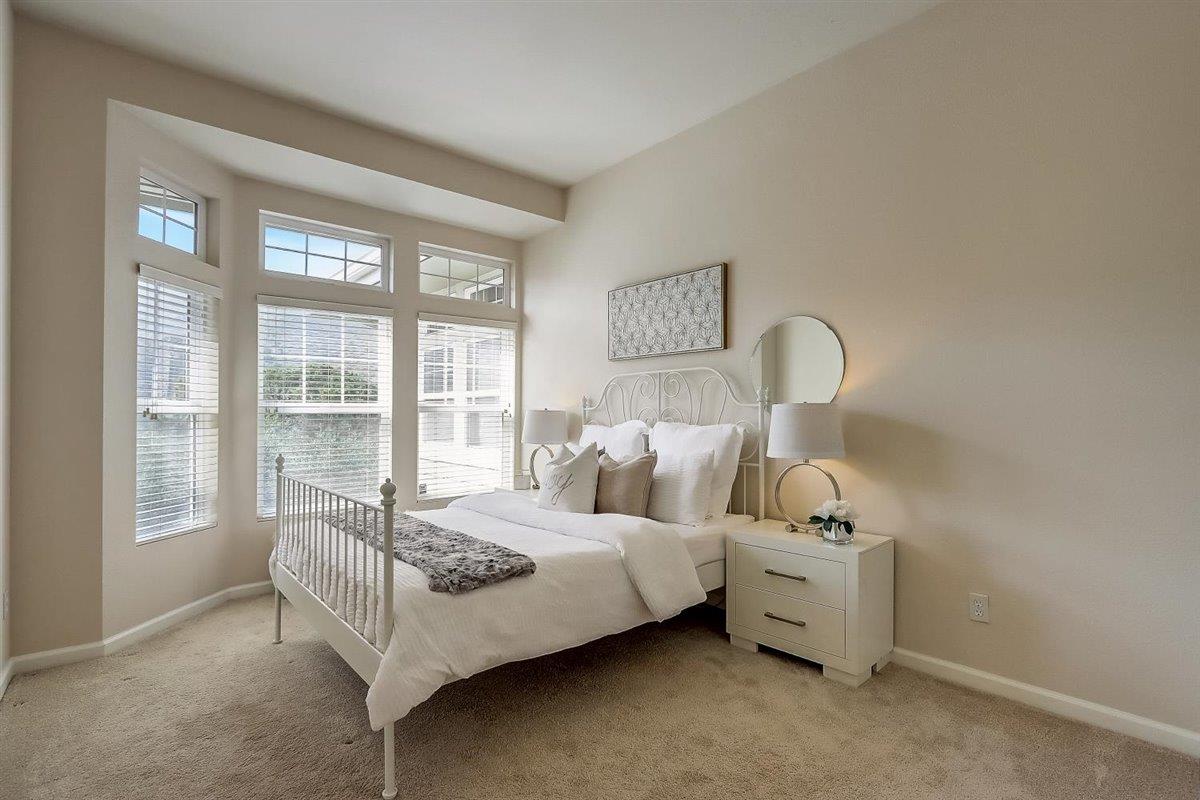 633 Swallowtail Court Brisbane, CA 94005 - Photo 21 of 42 a bedroom with bed and a large window