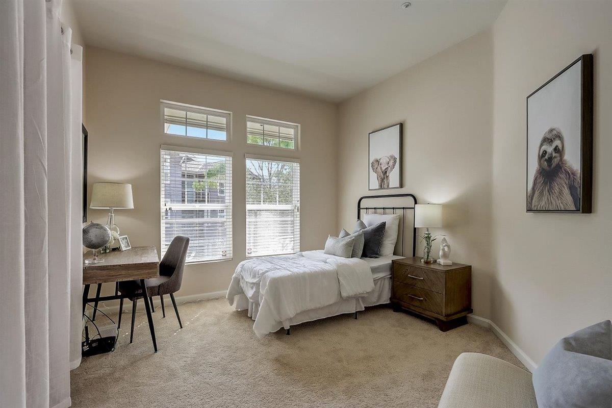 633 Swallowtail Court Brisbane, CA 94005 - Photo 23 of 42 a bed room with a bed and a chair