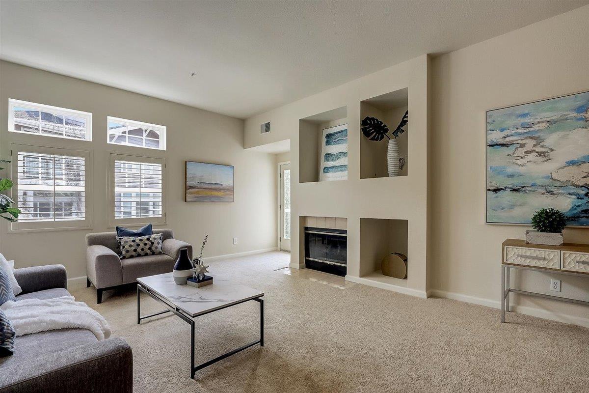 633 Swallowtail Court Brisbane, CA 94005 - Photo 6 of 42 a living room with furniture and a fireplace