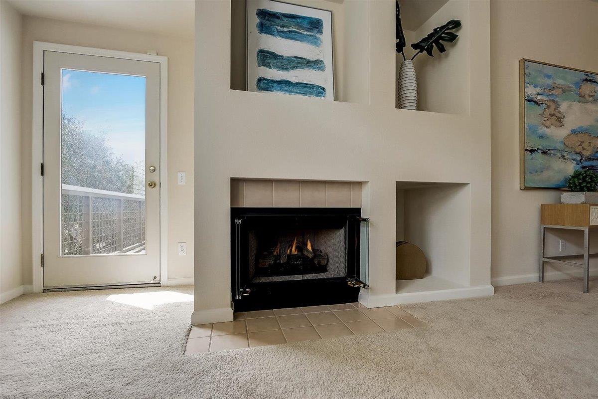 633 Swallowtail Court Brisbane, CA 94005 - Photo 7 of 42 a living room with furniture and a fireplace