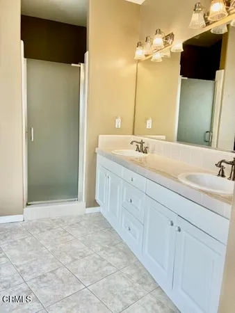 a bathroom with a tub and a sink