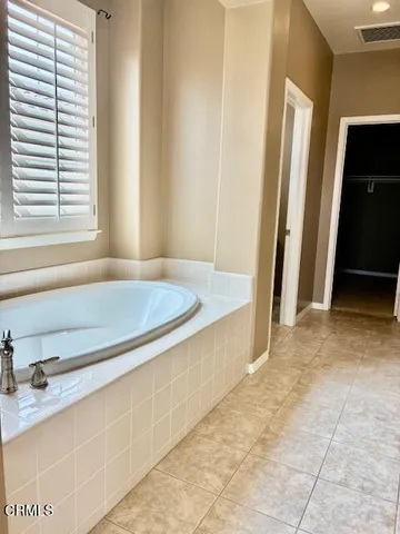 a bathroom with a sink a mirror and a shower