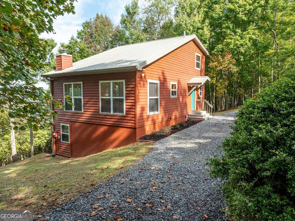 175 Oak Ledge Road Morganton, GA 30560 - Photo 13 of 50 a view of a house with a yard and wooden fence