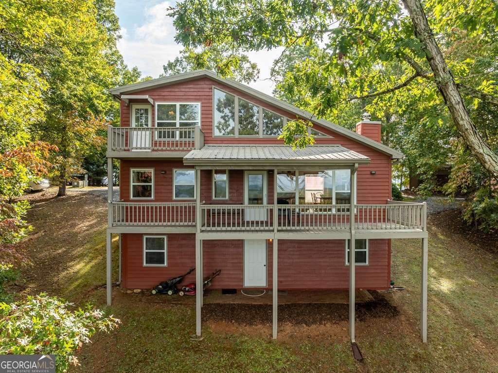 175 Oak Ledge Road Morganton, GA 30560 - Photo 20 of 50 a front view of a house with a garden