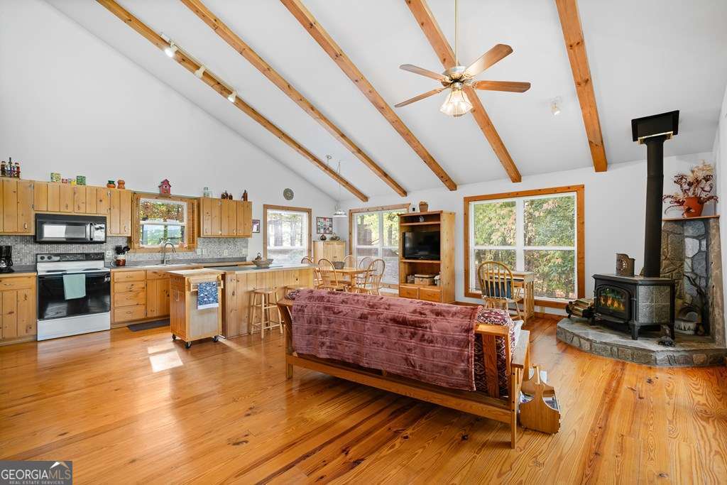 175 Oak Ledge Road Morganton, GA 30560 - Photo 34 of 50 a living room with furniture kitchen view and large windows
