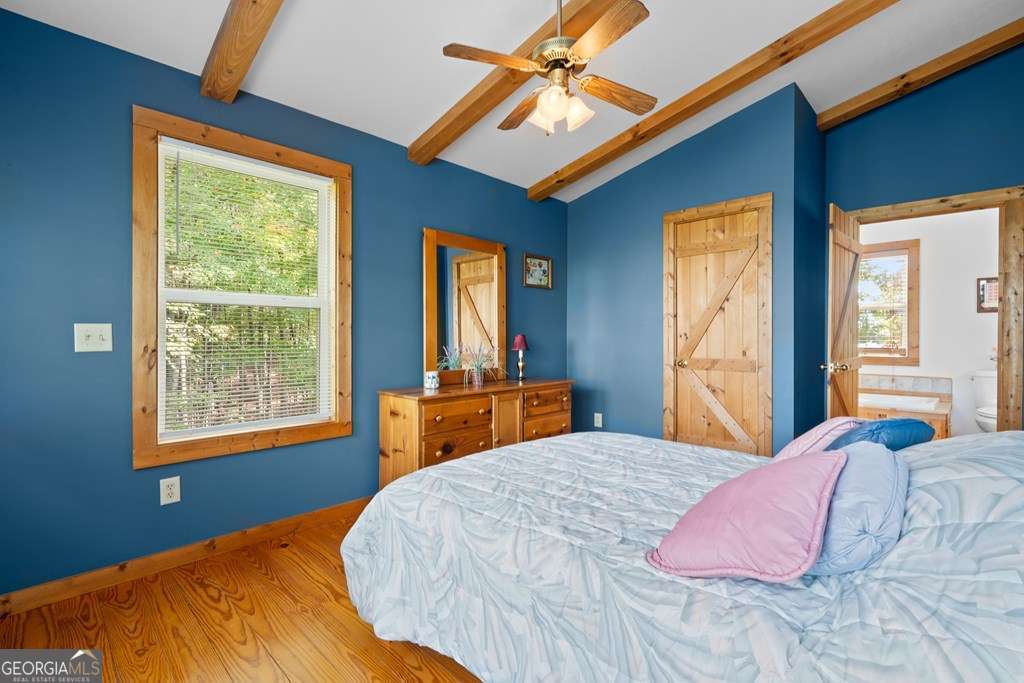 175 Oak Ledge Road Morganton, GA 30560 - Photo 38 of 50 a bedroom with a bed and a window