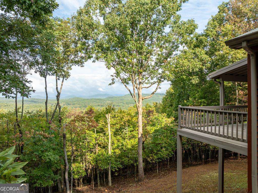 175 Oak Ledge Road Morganton, GA 30560 - Photo 8 of 50 a view of a balcony with lake view and trees