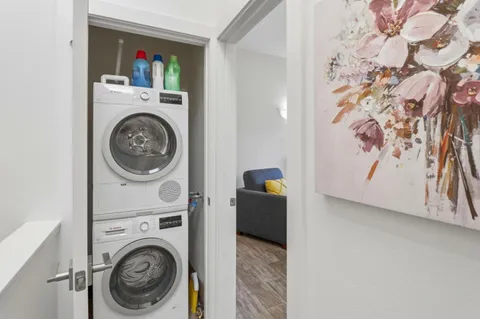 a view of a storage & utility room with washer and dryer