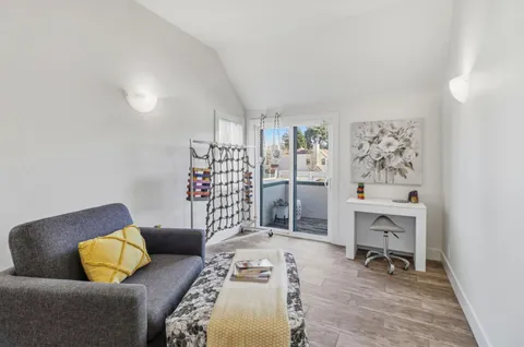 a bedroom with furniture and a book shelf