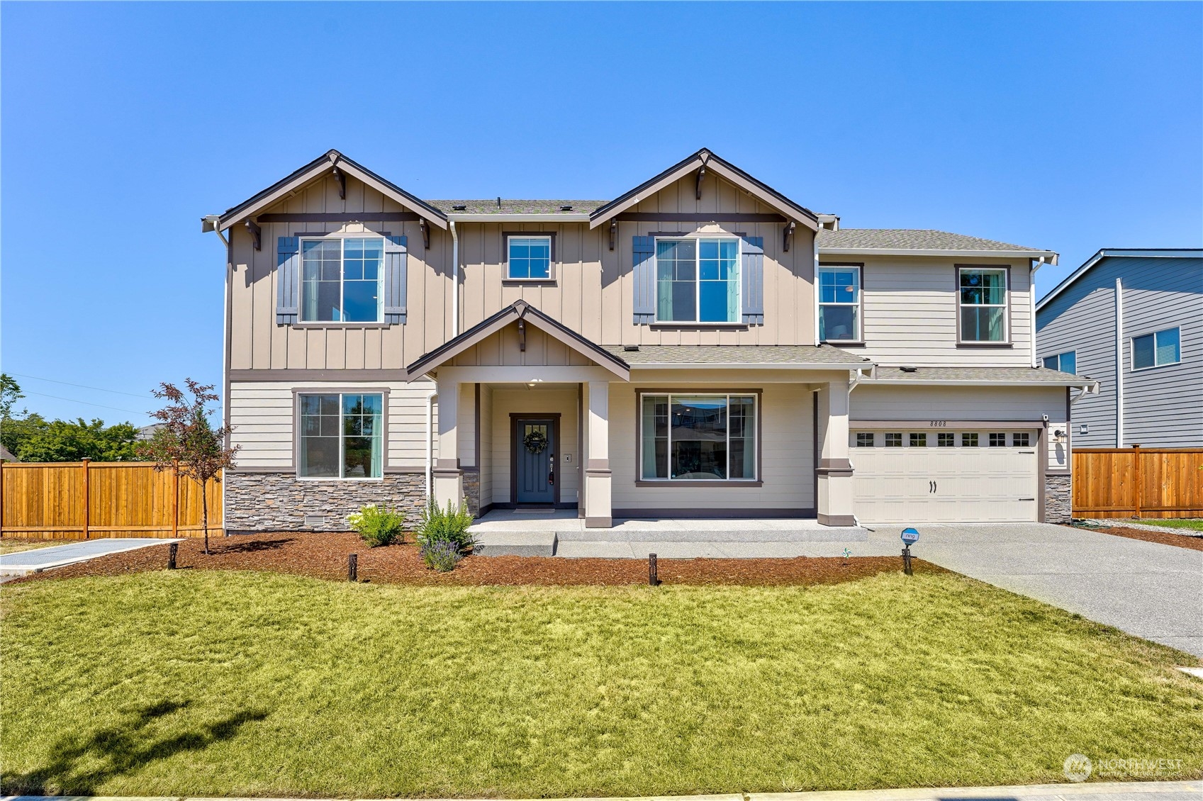 8808 Northeast 201st Place Bothell, WA 98011 - Photo 1 of 38 a front view of a house with a yard