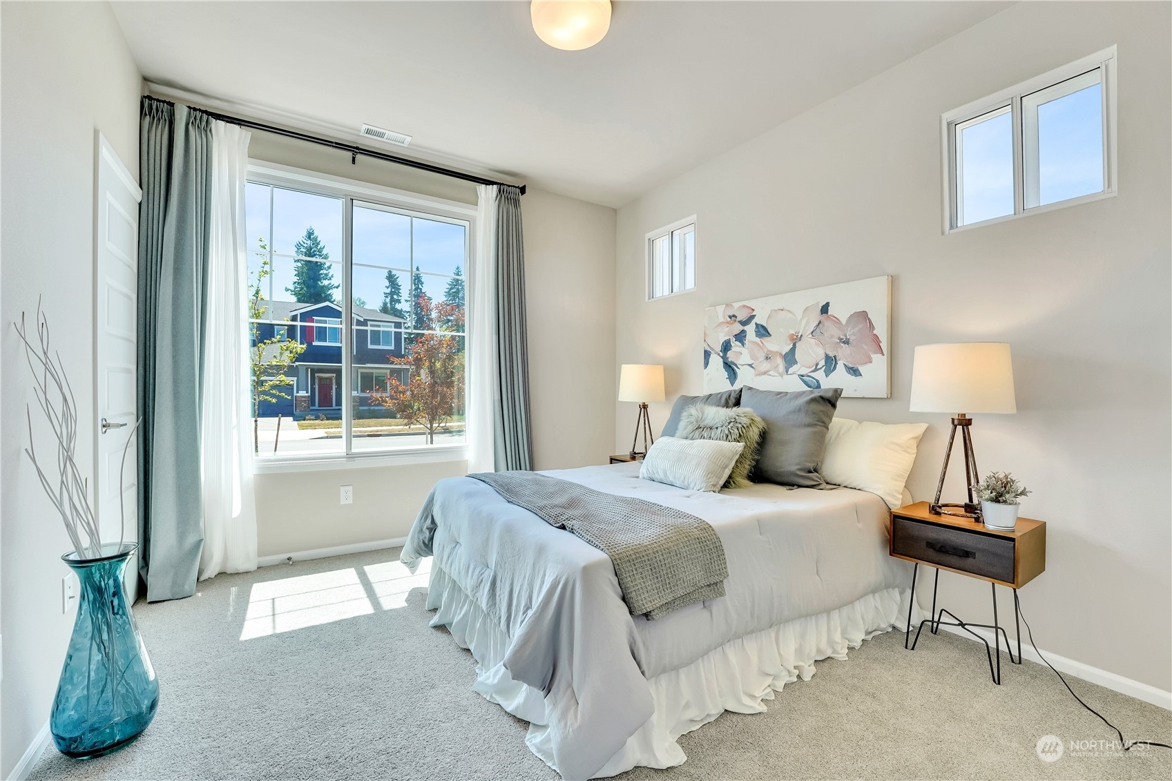 8808 Northeast 201st Place Bothell, WA 98011 - Photo 16 of 38 a bedroom with a bed and a window