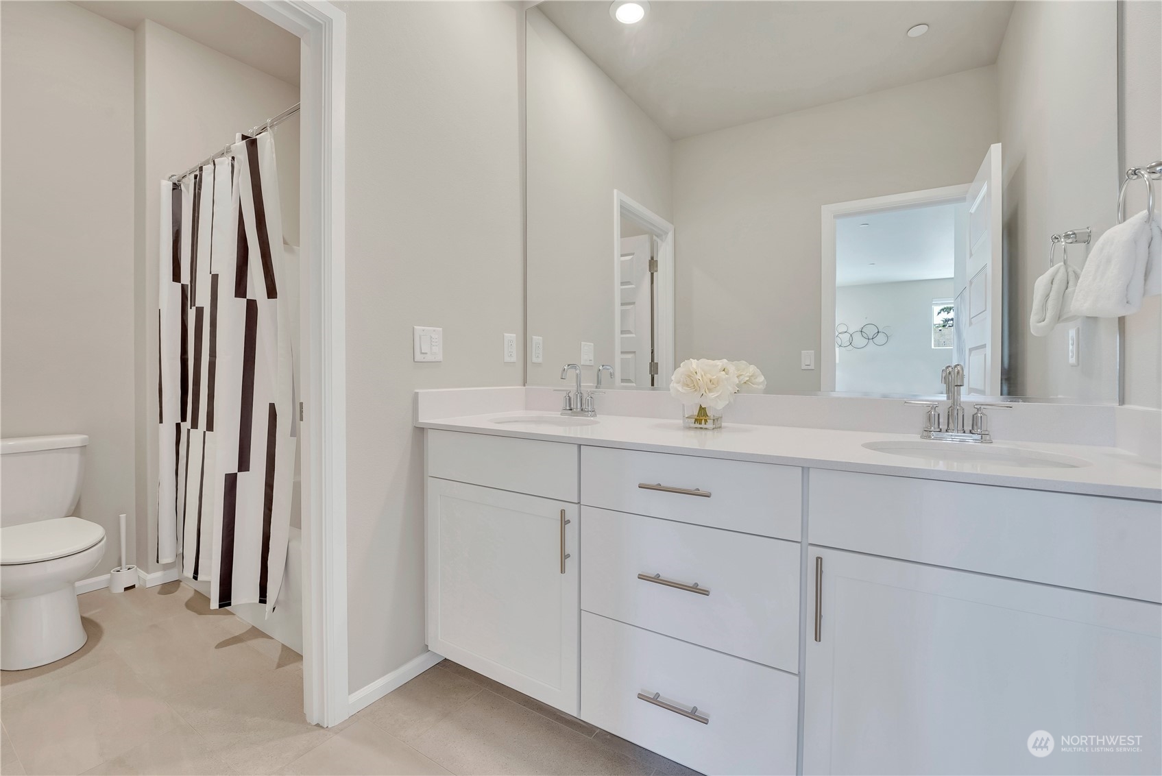 8808 Northeast 201st Place Bothell, WA 98011 - Photo 20 of 38 a bathroom with a toilet sink and mirror
