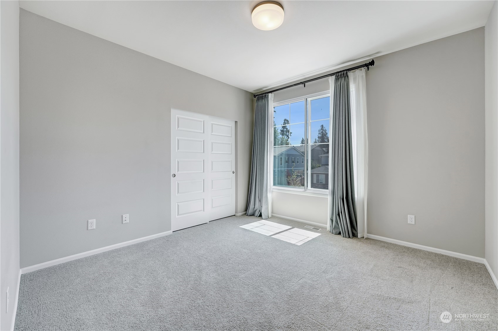 8808 Northeast 201st Place Bothell, WA 98011 - Photo 24 of 38 a view of an empty room with a window