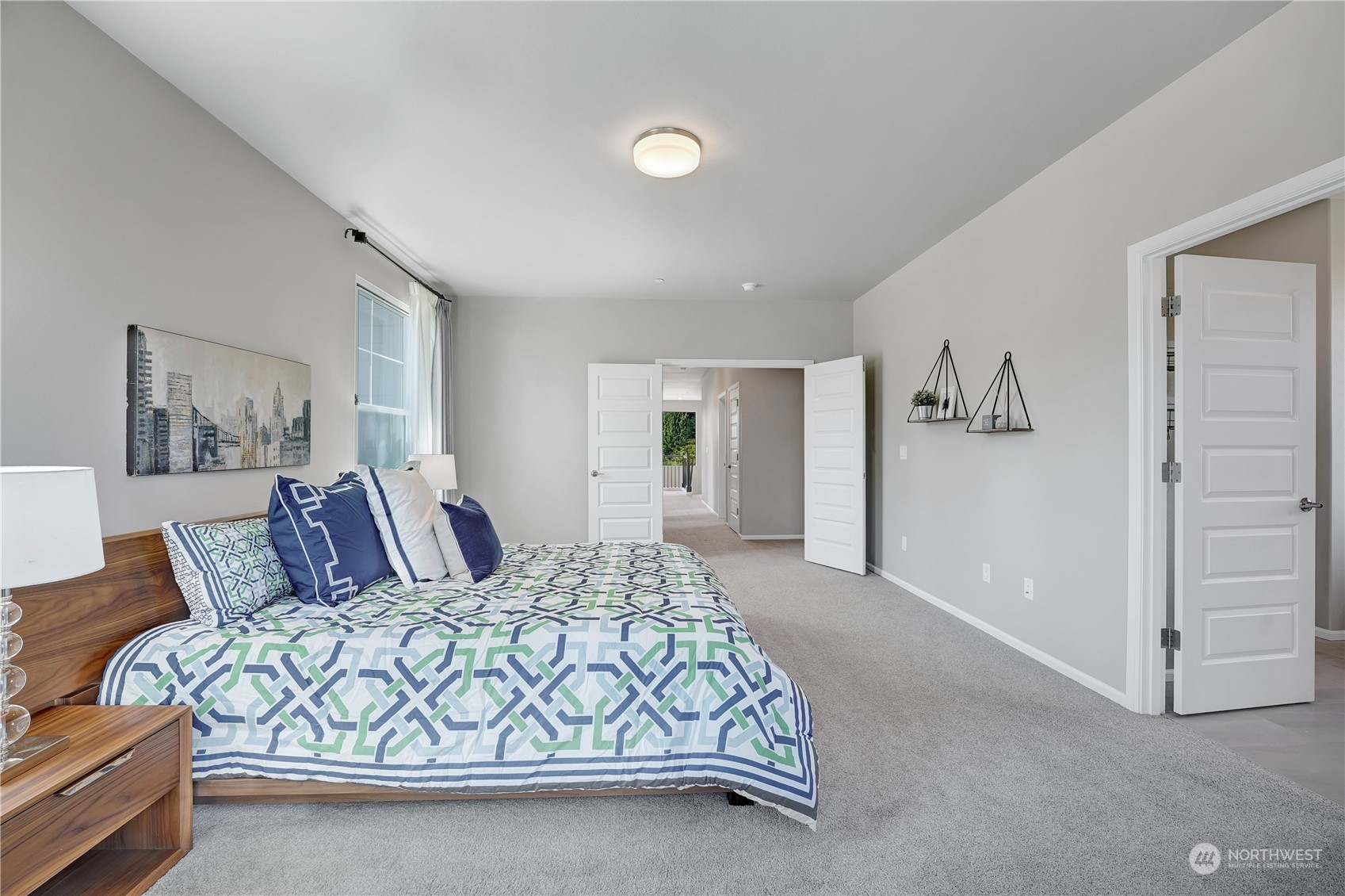 8808 Northeast 201st Place Bothell, WA 98011 - Photo 28 of 38 a bedroom with a large bed and a couch