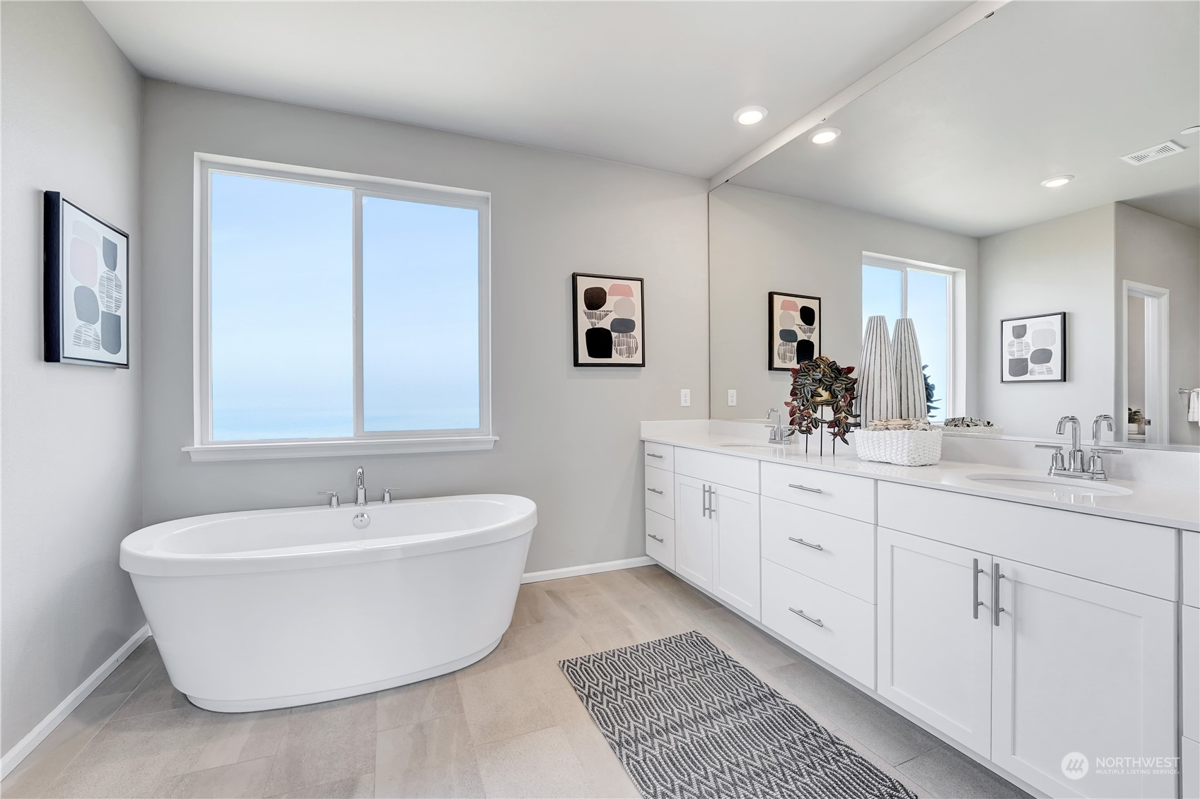 8808 Northeast 201st Place Bothell, WA 98011 - Photo 30 of 38 a spacious bathroom with a double vanity sink mirror and bathtub