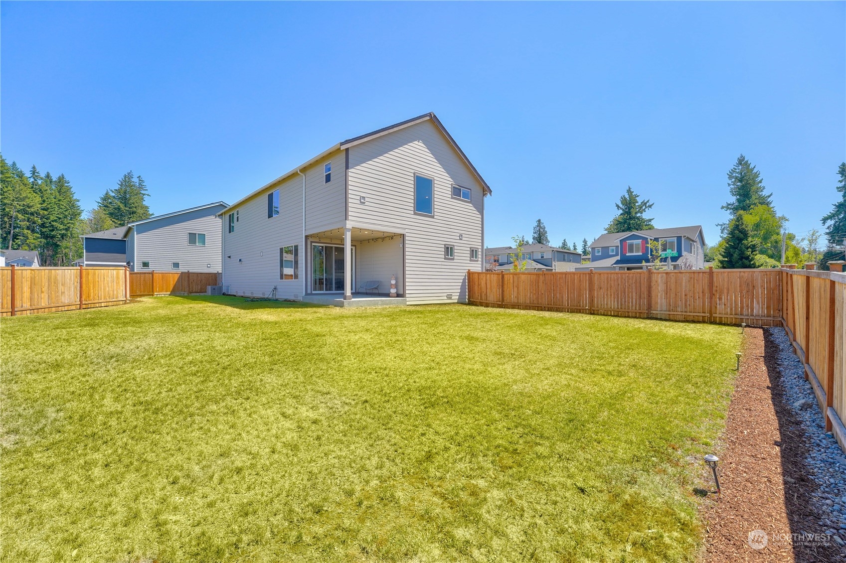 8808 Northeast 201st Place Bothell, WA 98011 - Photo 34 of 38 a view of a swimming pool with an outdoor space and seating area